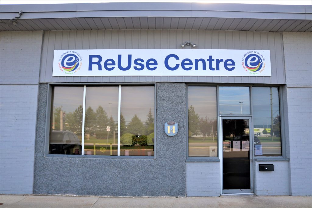 Front view of the E3 Community Services ReUse Centre building with sign and entrance.