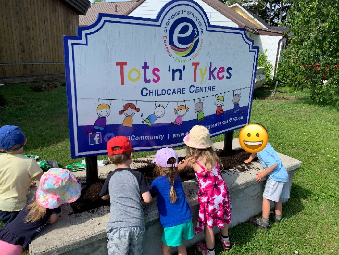 kids planting a garden